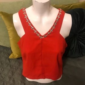 Double layer V Neck Shirt with Jewel details.